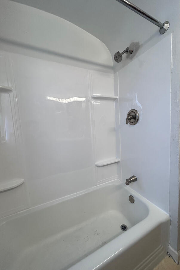 Shower and bath tub surround